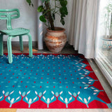 Blue and red hedgerow rug in living space.