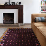 Living room with dark brown and mustard hedgerow flatweave wool rug.