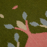 Detail of Green and Pink Hedgerow flatweave rug handwoven in wool.