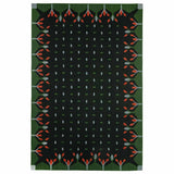 Dark forest green flatweave rug handwoven with a decorative border inspired by hedgerows.