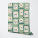 Folk Tales wallpaper in pistachio green showing repeat pattern with illustrated animals.