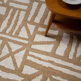 Mustard tudor rug handwoven with graphic organic lines on a mottled natural base.