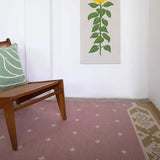 Rose pink and ochre manali rug with chair