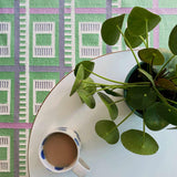 Green Labourdonnais check grid rug in a living room with coffee table and plant