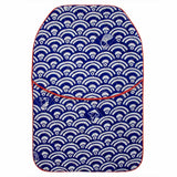 Navy blue quilted hot water bottle cover featuring a handprinted Japanese-inspired Seigaiha design, with contrasting red piping.