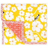 Yellow baby quilt hand printed with vibrant illustrated flowers and birds, quilted with cotton.