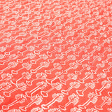 Detail of coral red hibiscus motif on Yellow Weaver Quilt