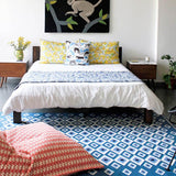 Bedroom with Blue Evil Eye Flatweave Wool Rug