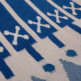 Detail of Blue Darjeeling Flatweave Wool rug handwoven with wide blue stripes and triangle border.