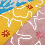 Yellow and Pink Hand tufted Hibiscus rugs with contemporary floral design