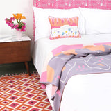 Bedroom with Orange Evil Eye Flatweave Wool Rug
