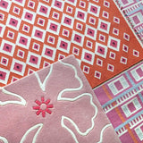 Orange Evil Eye Flatweave wool rug with pink rugs
