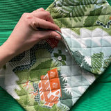 Close-up of the Mountain Zig Zag quilted hot water bottle cover with the flap lifted to show the envelope opening.